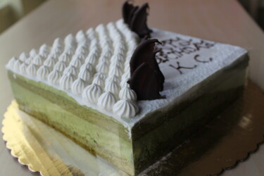 A Custom Green Tea Mousse cake with two designs