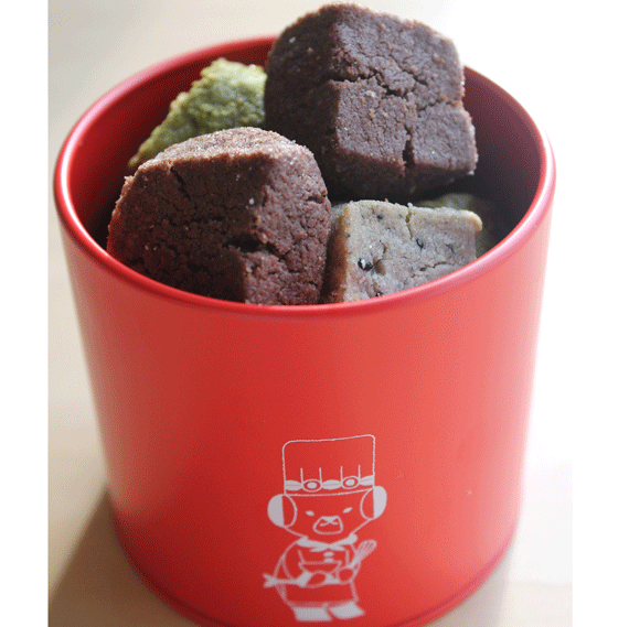 Cookies in a red cylindrical container.